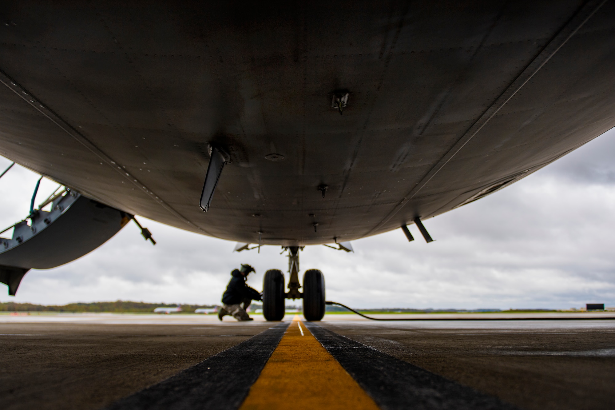 Senior Airman Zachary Anderson, 911th Aircraft Maintenance Squadron crew chief, checks the air pressure of a tire on a C-17 Globemaster III at the Pittsburgh International Airport Air Reserve Station, Pennsylvania, May 6, 2020.