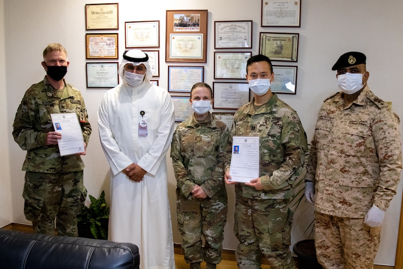 From left: U.S. Army Col Ian Black, command surgeon for 1st Theater Sustainment Command, Sheik Abdullah M. Al-Sabah, chief of medical services for the Kuwait Ministry of Defense, U.S. Army Maj. Adrienne Kramer, deputy command surgeon for Area Support Group – Kuwait, U.S. Army Capt. Yusheng Chen, ASG-KU command dentist, and Dr. Raed R. Altajalli, a Kuwaiti medical officer. Black and Chen are the first U.S. military personnel to be medically licensed for practice at Kuwait Ministry of Defense hospitals, an initial step towards medical interoperability between the two nations. (U.S. Army photo by Sgt. Sean Harding)