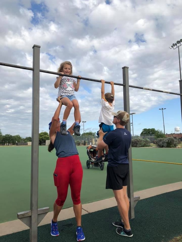 Members of Goodfellow help their kids complete a portion of The Murph Challenge at the Mathis Fitness Center on Goodfellow Air Force Base, Texas, May 25, 2020. Goodfellow had members of every branch participating in U.S. Navy Lt. Michael P. Murphy’s honor. (Courtesy photo)