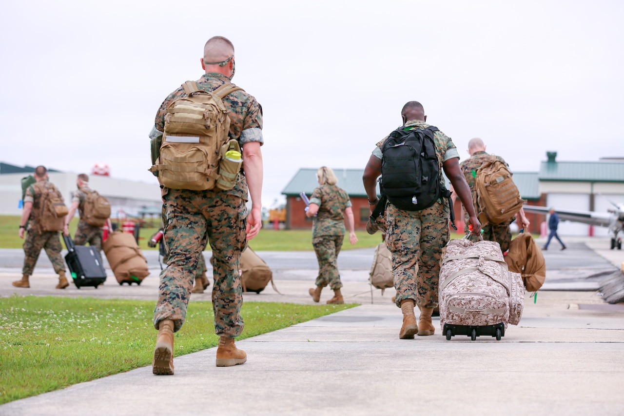 Marines and sailors returning to Marine Corps Air Station New River.