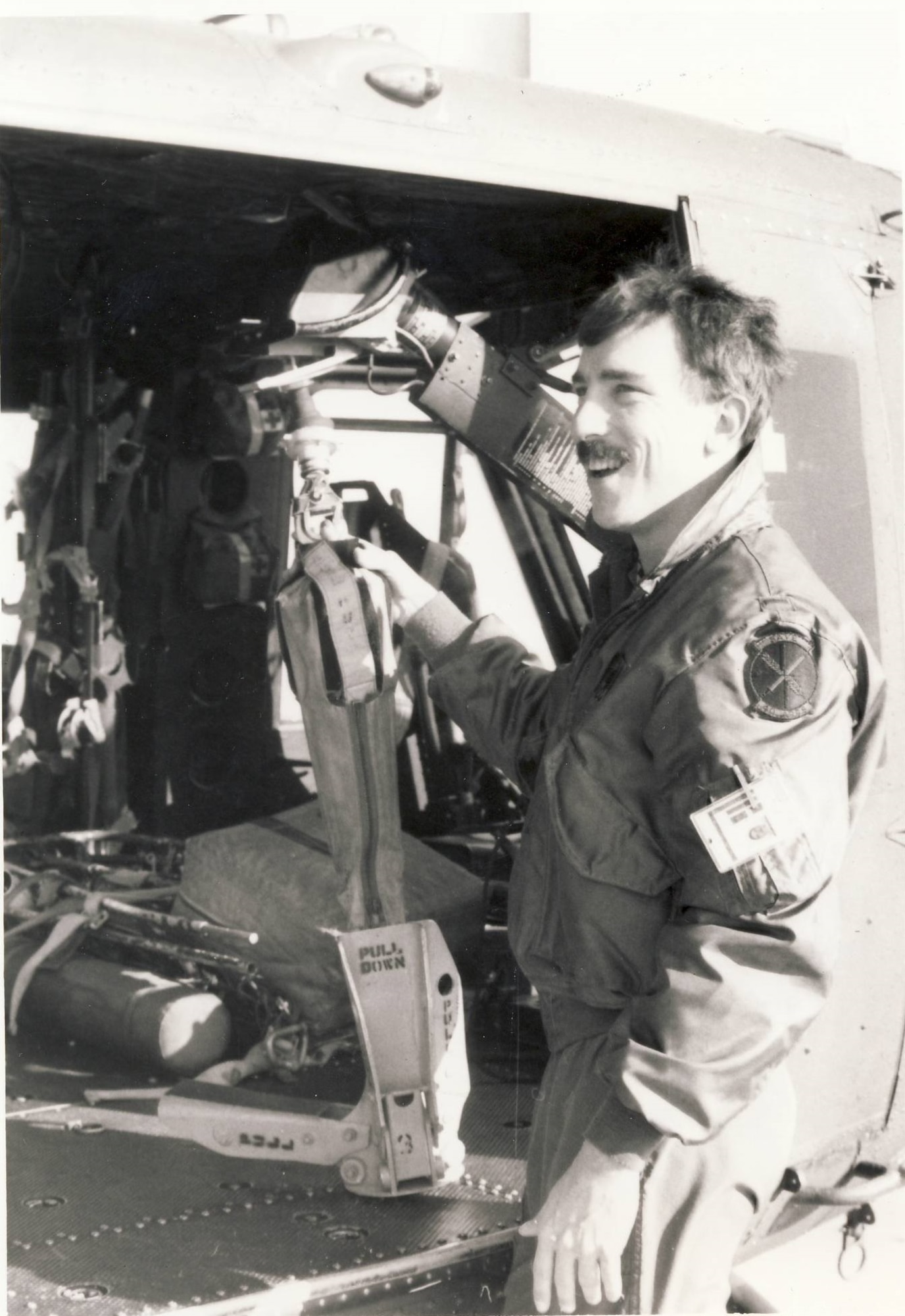 Second Lieutenant Gene Vey, Detachment 4, 40th Aerospace Rescue and Recovery Squadron (ARRS), posing in front of the open door of a rescue and recovery UH-1N helicopter at Hill AFB, Utah, in the late 1970s or early 1980s.