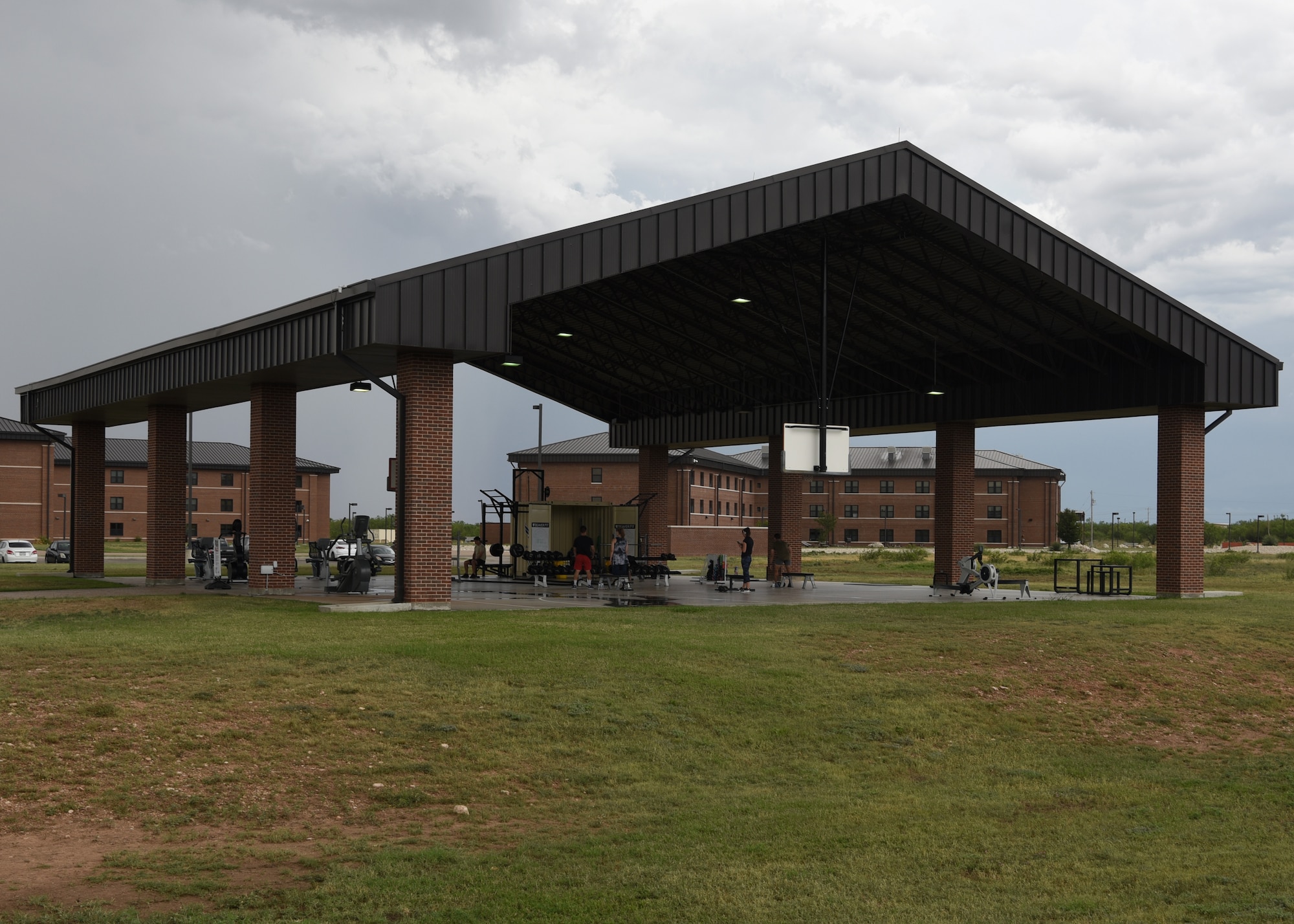 Military members exercise at the Mathis Fitness Center’s outdoor facilities, on Goodfellow Air Force Base, Texas, May 28, 2020. The open-air concept fitness center provided more fitness options for base personnel, while supporting health and safety precautions such social distancing during the COVID-19 pandemic.  (U.S. Air Force photo by Airman 1st Class Abbey Rieves)