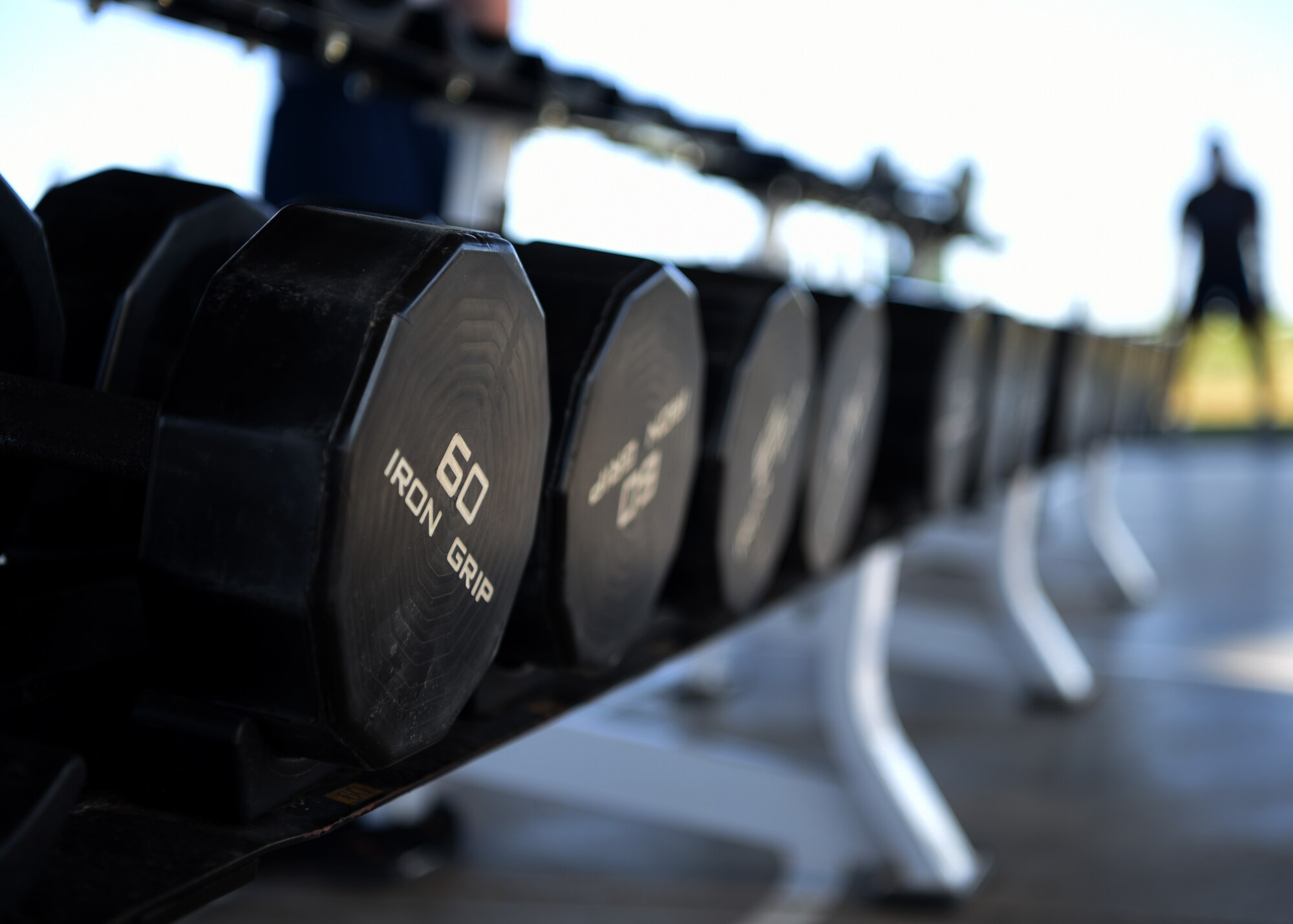 Free weights are useable at the Mathis Fitness Center’s outdoor facilities, on Goodfellow Air Force Base, Texas, May 26, 2020. The base introduced the new open-air workout facility during the transition to the Health Protection Level Bravo, and strictly followed the recommended COVID-19 health and safety precautions. (U.S. Air Force photo by Airman 1st Class Abbey Rieves)