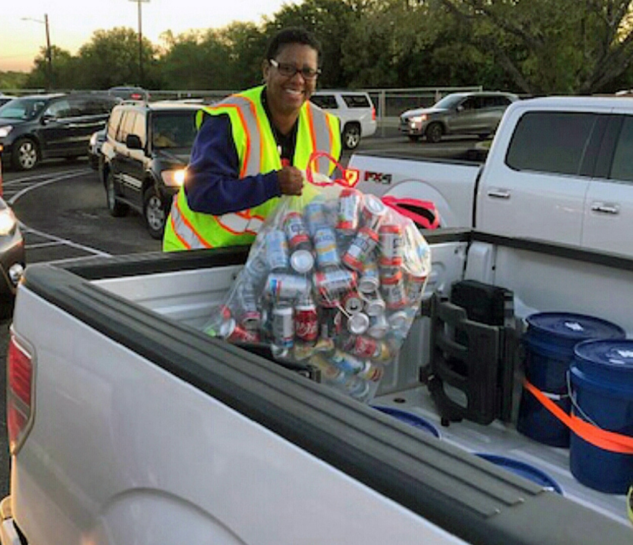 Woman collects cans