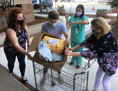 The Brooke Army Medical Center Auxiliary held its annual welfare grants distribution May 20, at the BAMC Main Entrance.