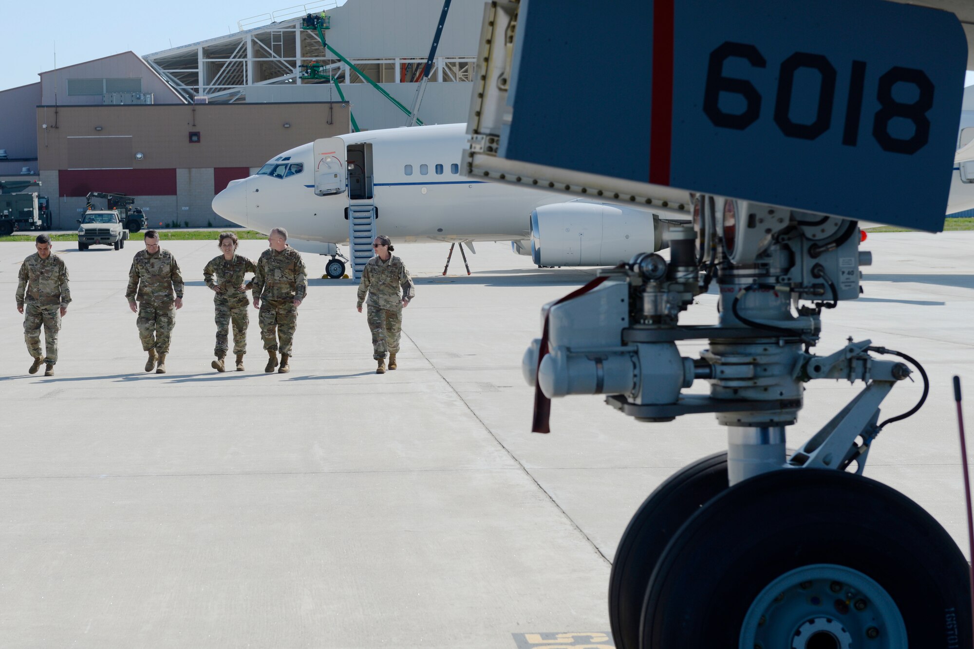 Maj. Gen. David Mikolaities, New Hampshire National Guard Adjutant General, Gen. Joseph L. Lengyel, the Chief of the National Guard Bureau, Brig. Gen. Laurie Farris, NHNG Assitant Adjutant General for Air, Col. John Pogorek, 157th Air Refueling Wing Commander, and Chief Master Sgt. Erica Rhea, 157th ARW Command Chief, walk across the flightline on their way to tour a KC-46, Pease Air National Guard Base, Newington, N.H., May 27. (U.S. Air National Guard Photo by Senior Master Sgt. Timm Huffman)