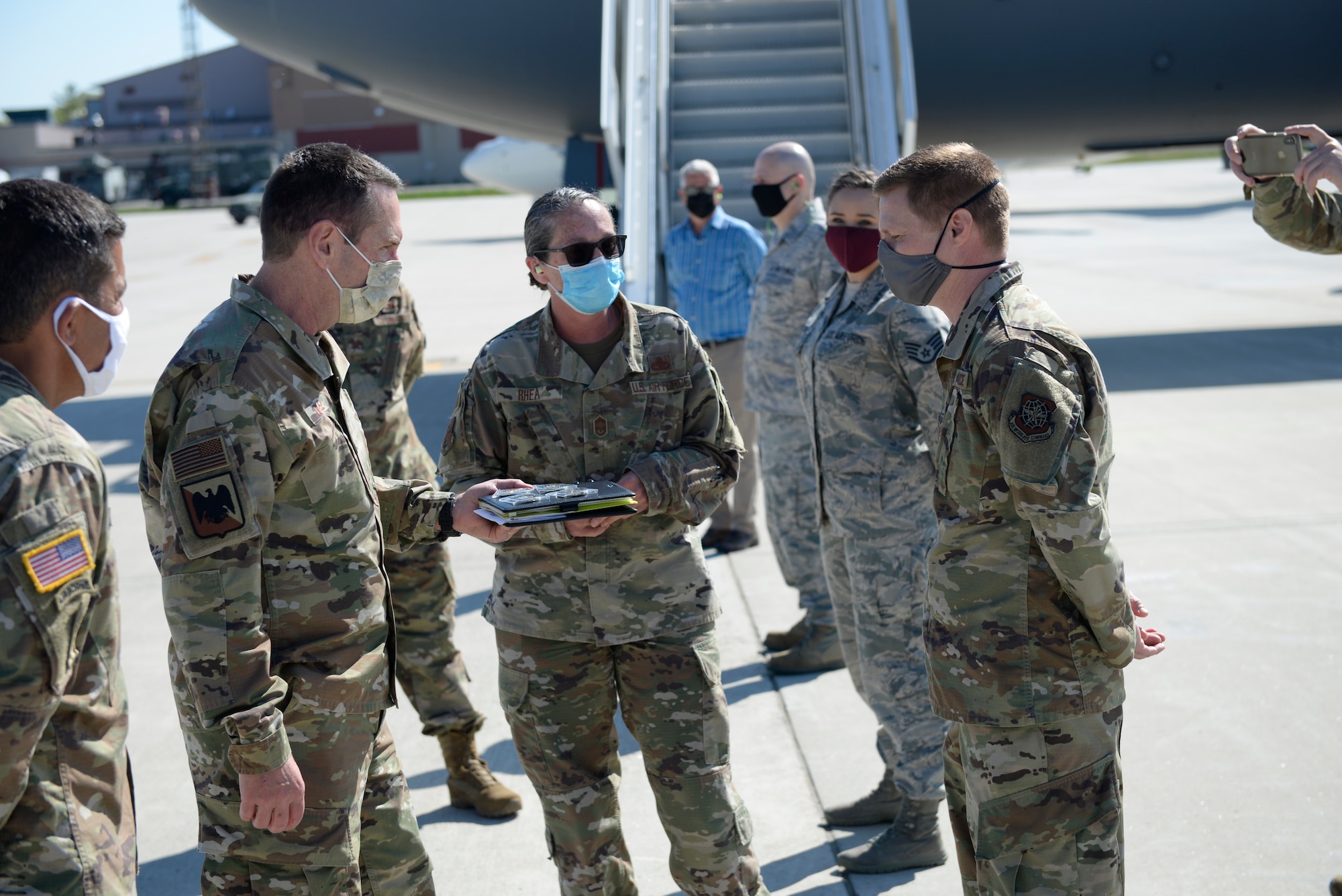 During his visit to Pease Air National Guard Base, Newington, N.HH., Gen. Joseph L. Lengyel, the Chief of the National Guard Bureau, presents a coin to Tech. Sgt. Andrew Morrison, a 157th Air Refueling Wing maintainer, for recent outstanding performance, May 27, 2020. (U.S. Air National Guard photo by Senior Master Sgt. Timm Huffman)