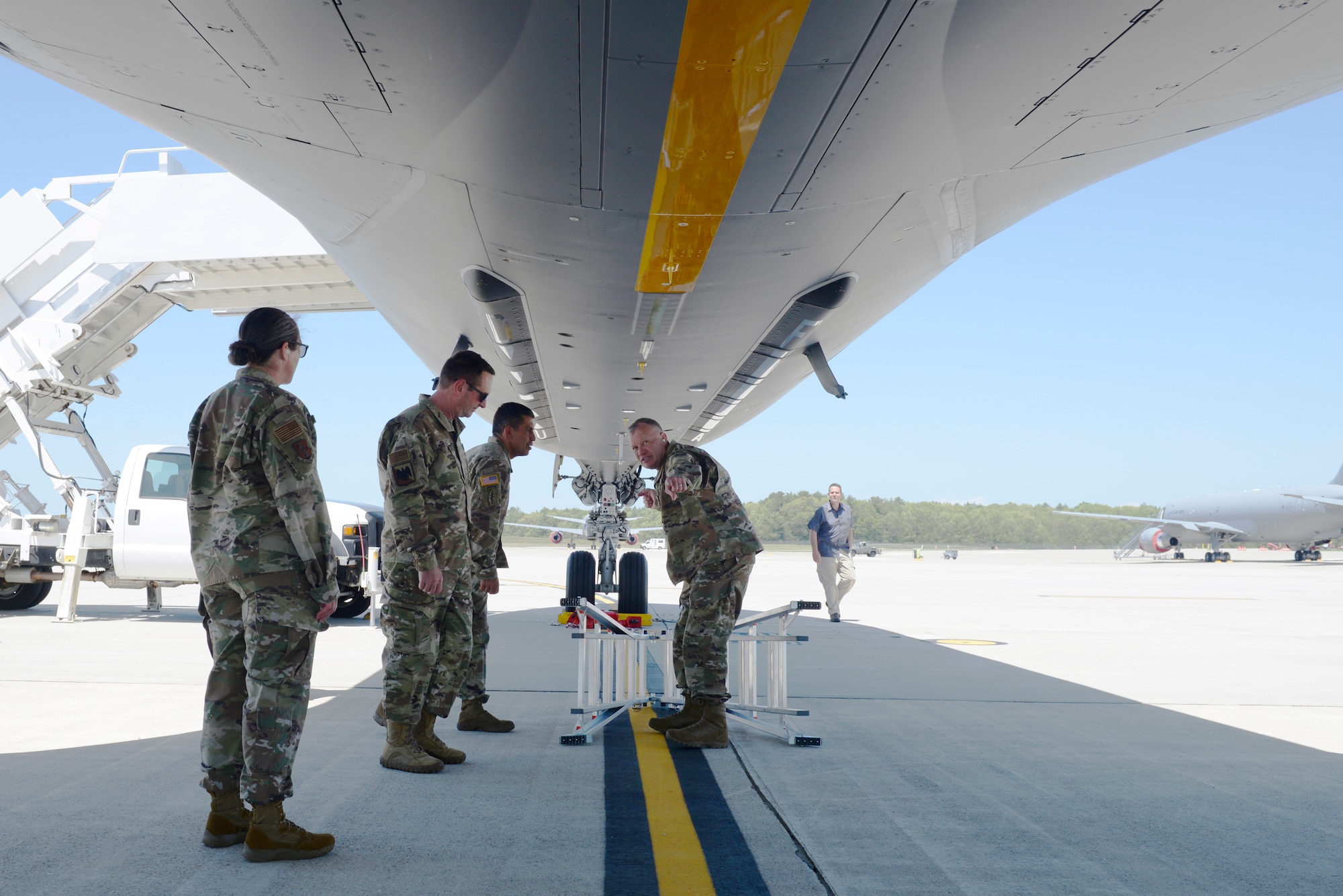 Col. John Pogorek, 157th Air Refueling Wing Commander, answers questions from Gen. Joseph L. Lengyel, the Chief of the National Guard Bureau, about the KC-46A Pegasus during the general's visit to Pease Air National Guard Base, Newington, N.H., May 27, 2020. Pictured from left to right are Chief Master Sgt. Erica Rhea, 157th ARW Command Chief, Gen. Lengyel, Maj. Gen. David Mikolaities, New Hampshire National Guard Adjutant General, and Col. Pogorek. (U.S. Air National Guard photo by Senior Master Sgt. Timm Huffman)