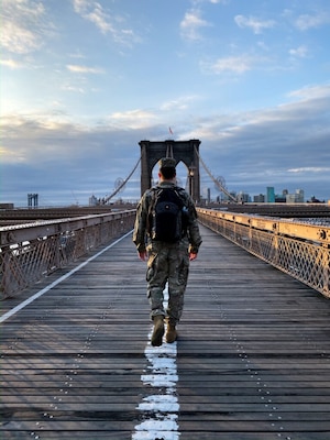 U.S. Army Engineer Research and Development Center’s Cold Regions Research and Engineering Laboratory Research Associate Army 1st Lt. Eoghan Matthews walks across the Brooklyn Bridge on his way to work at the U.S. Army Corps of Engineers (USACE) New York District, March 26, 2020. 
Matthews was activated to assist the USACE New York District with completing site assessments, which are provided to local, state and federal partners, so that decisions can be made about where and when alternate care facilities are constructed as additional support to hospitals during the COVID-19 outbreak.