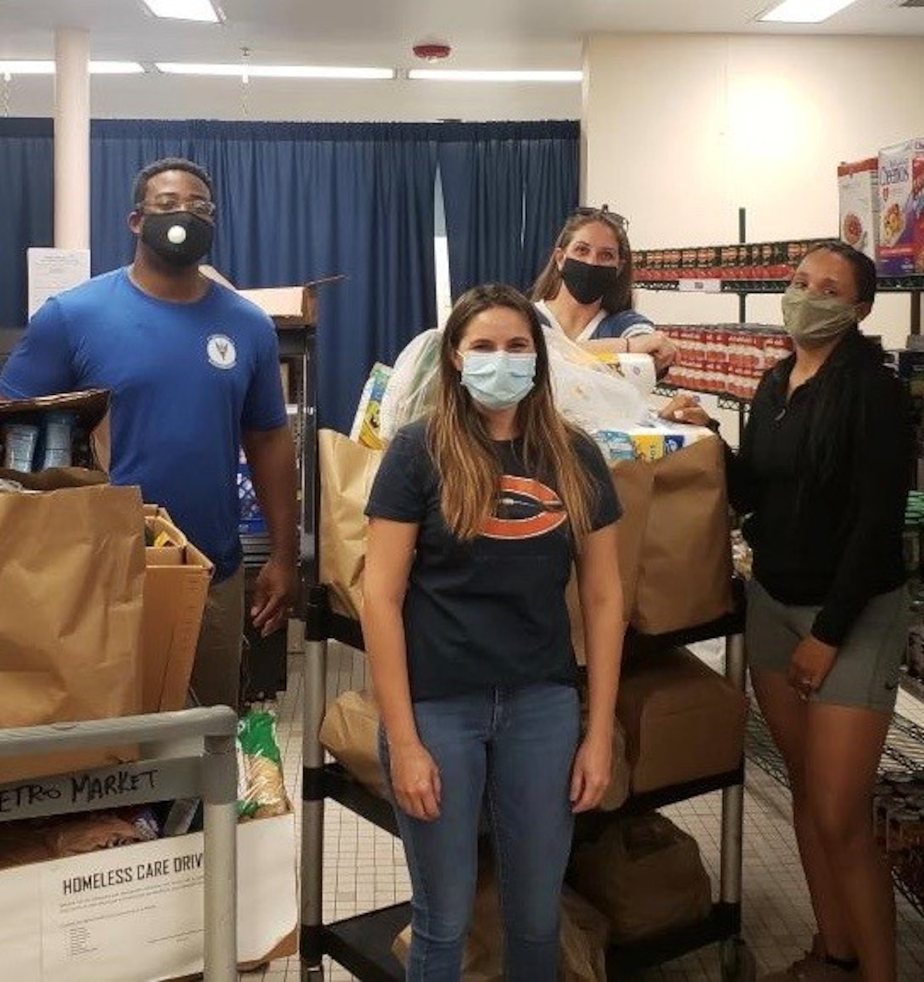 Members of the MacDill Air Force Base 5/6 Council, donate goods during a homeless care drive, May 23, 2020, in Tampa Fla. Council members collected goods at MacDill Air Force Base, Fla., which were donated to the less fortunate in the Tampa community.