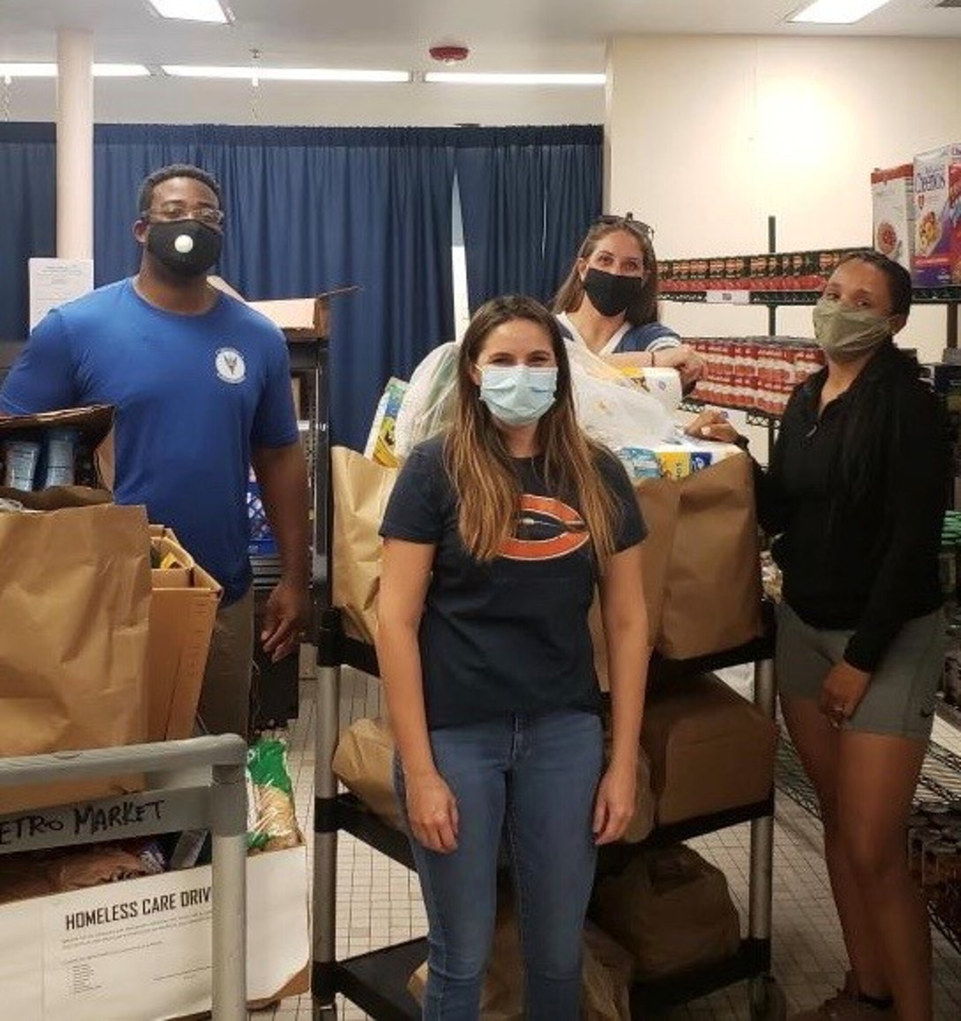 Members of the MacDill Air Force Base 5/6 Council, donate goods during a homeless care drive, May 23, 2020, in Tampa Fla. Council members collected goods at MacDill Air Force Base, Fla., which were donated to the less fortunate in the Tampa community.