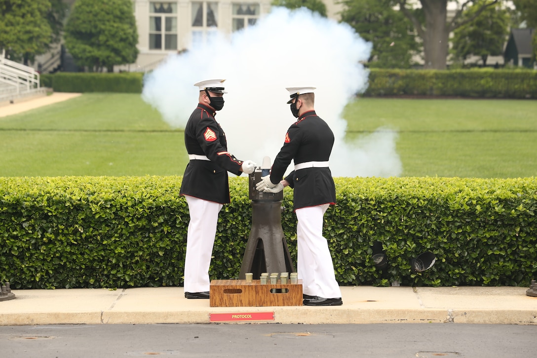 Body Bearers fire a cannon on the parade deck at Marine Barracks Washington, D.C., May 26.