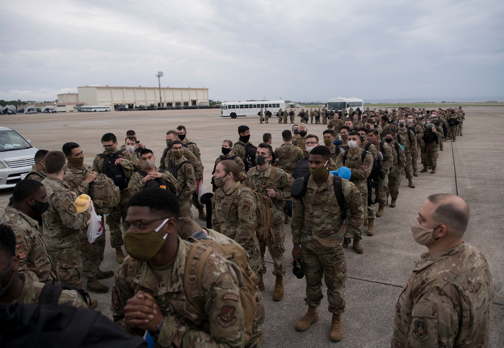 Airmen board an aircraft.