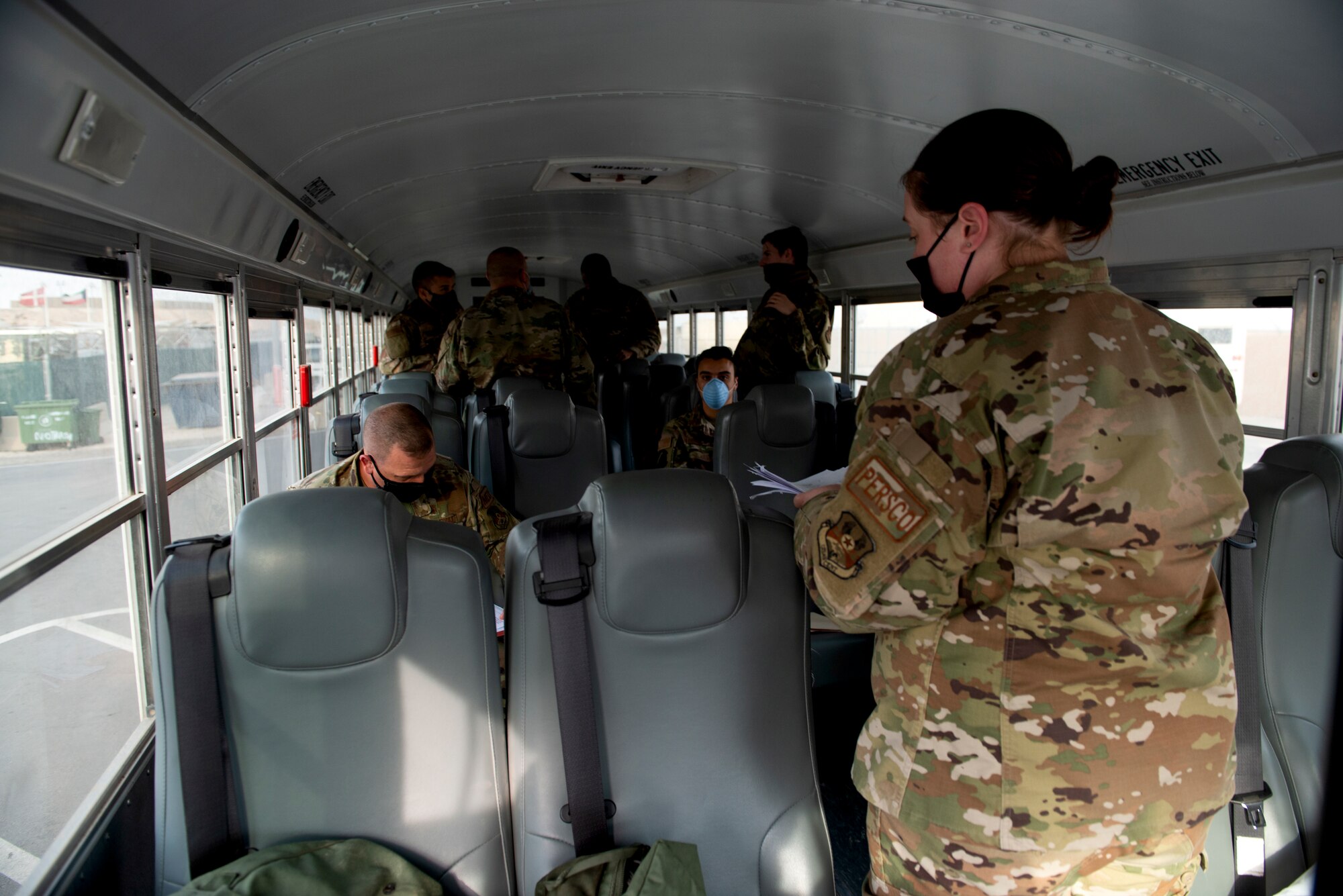 Staff Sgt. Jordan Bailey, 386th Expeditionary Force Support Squadron Personnel Support for Contingency Operations member, collects in-processing paperwork from personnel coming into Ali Al Salem Air Base, Kuwait, May 19, 2020. PERSCO is strictly a deployed environment function and is a vital task to ensure proper accountability takes place within the Area of Responsibility.(U.S. Air Force photo by Senior Airman JaNae Capuno)