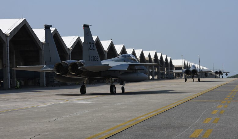 F-15C Eagles taxi along the flightline.