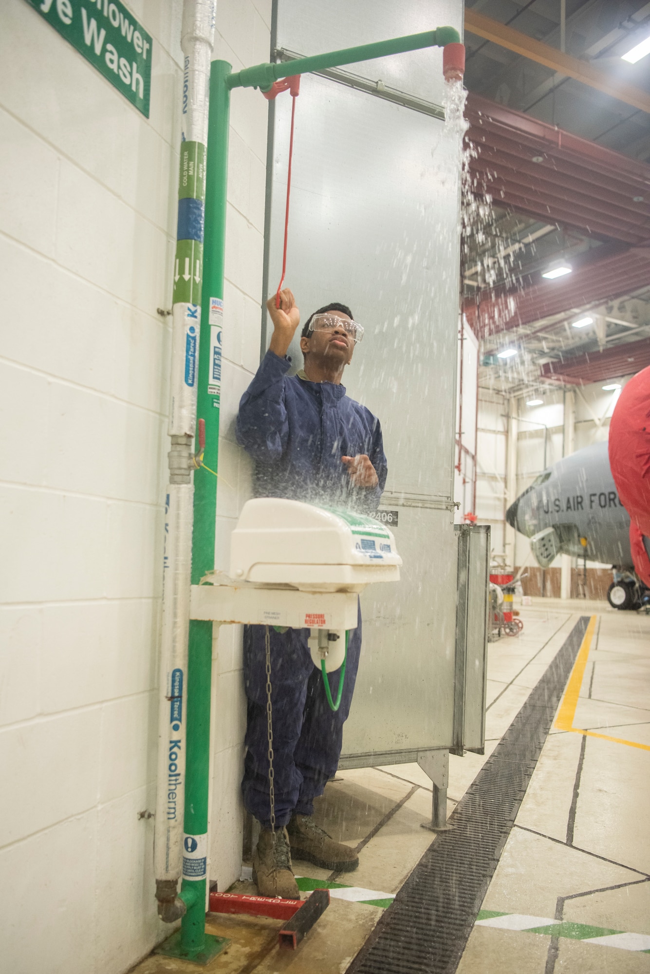 Airman 1st Class Dezmond Ross, 100th Maintenance Squadron fuel systems repair apprentice, tests the eyewash station inside the fuel systems shop at RAF Mildenhall, England, May 27, 2020. The eyewash station is checked daily and is one of many safety measures implemented to protect Airmen while working on aircraft fuel systems. (U.S. Air Force photo by Airman 1st Class Joseph Barron)