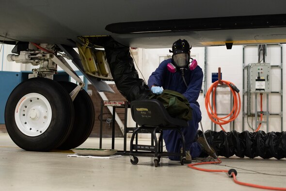 Airman 1st Class Dezmond Ross, 100th Maintenance Squadron fuel systems repair apprentice, puts on his static-resistant suit at RAF Mildenhall, England, May 27, 2020. The suit is worn inside fuel cells to protect Airmen from hazardous materials and to limit the creation of static electricity in an environment containing fuel vapor. (U.S. Air Force photo by Airman 1st Class Joseph Barron)