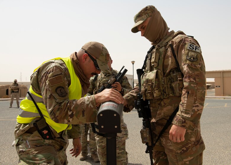 Security Forces Airman clears his weapon
