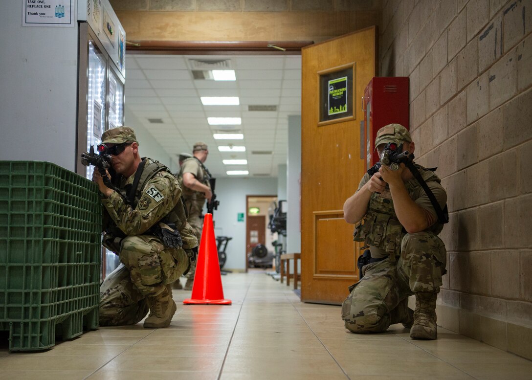 security forces sweep building