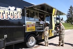 Cooks prepare to work in an Army food truck in Germany.