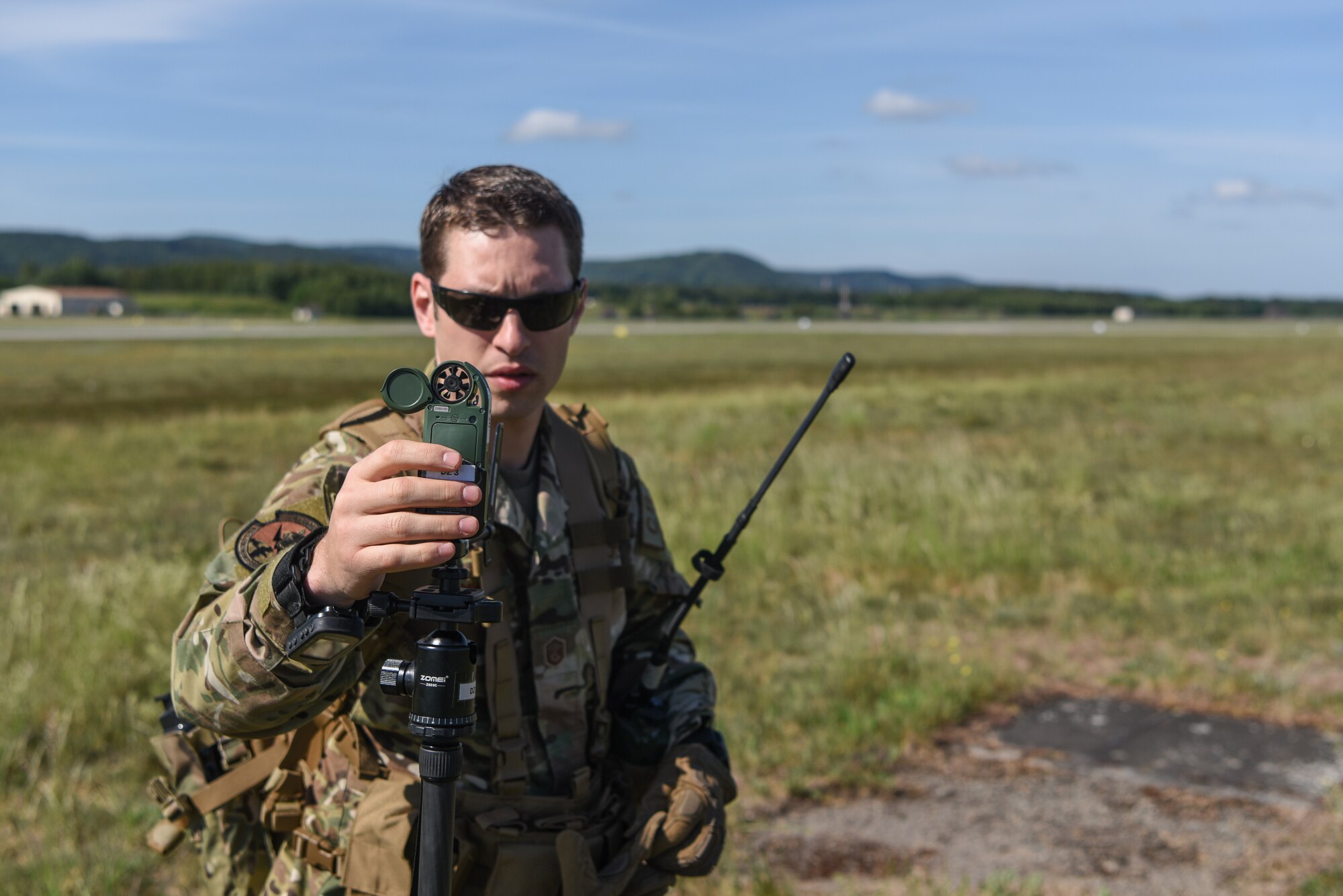 Photo of Airman using an anemometer