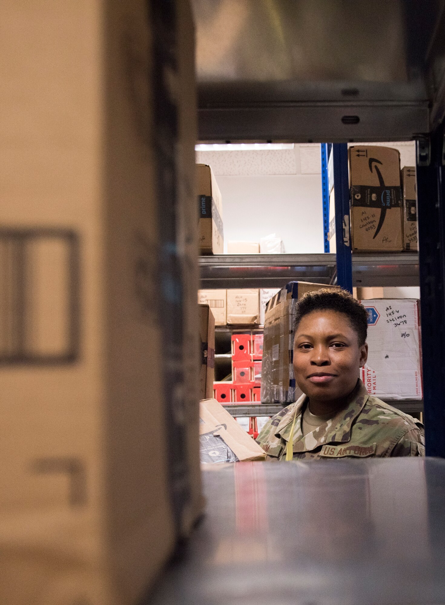 A photo of an Airman collecting a package.