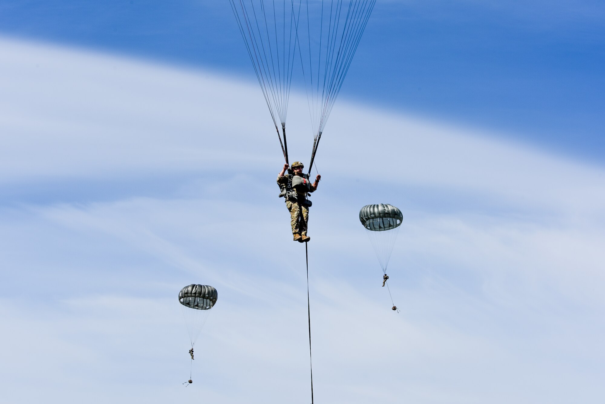 Photo of paratroopers descending to the ground