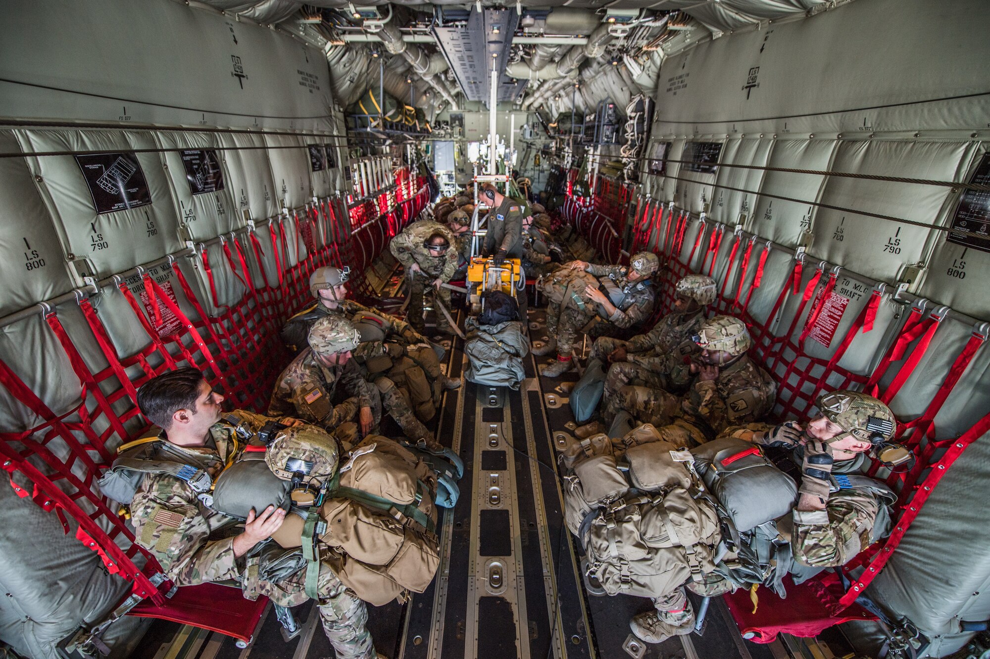 Photo of Airmen sitting in a C-130J