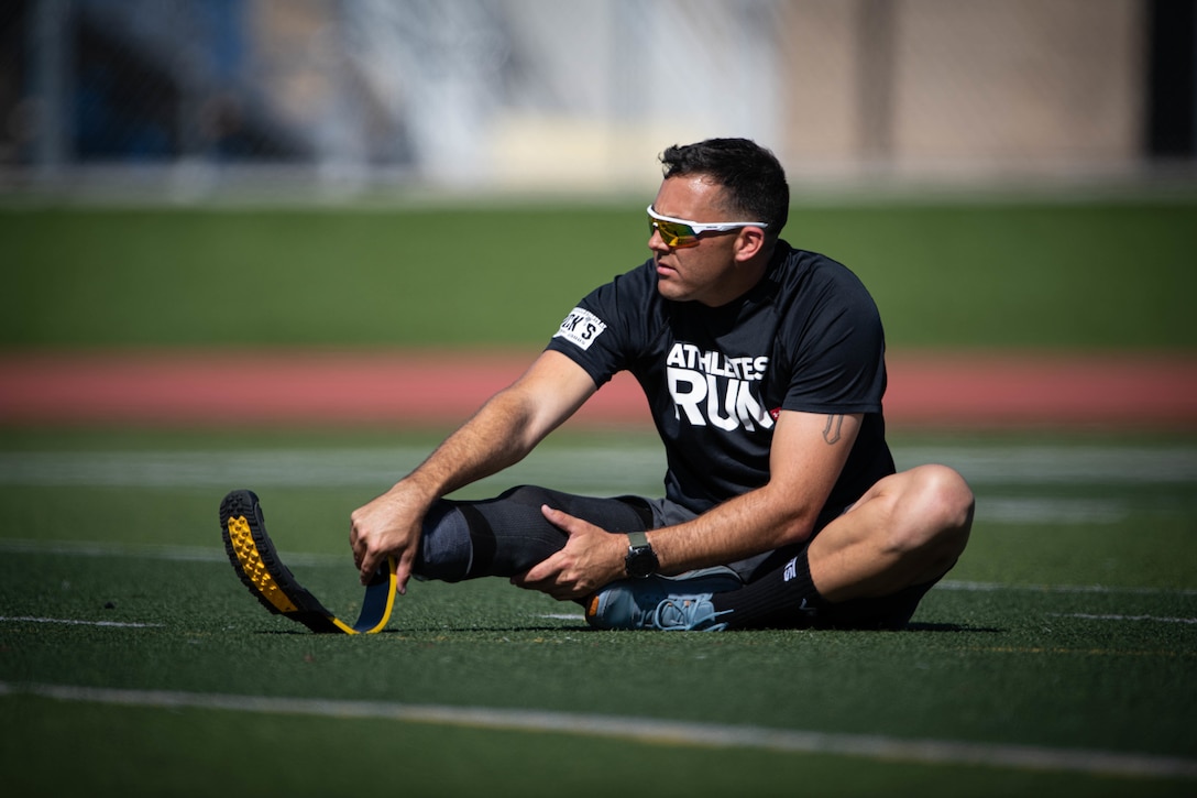 A U.S. Marine stretches before practice during the 2020 Marine Corps Trials at Camp Pendleton, Calif., March 3.