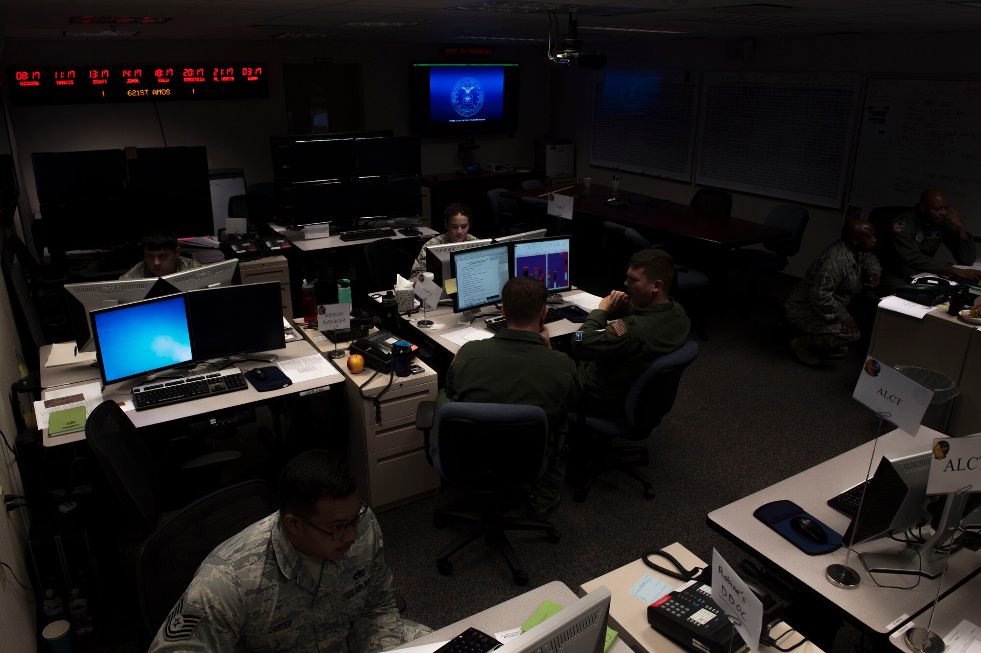 Members of the 621st Air Mobility Operations Squadron work during Exercise Mobility Guardian in the Weapon Systems Trainer at Joint Base McGuire-Dix-Lakehurst, N.J., August 1, 2017. The WST is designated as the primary air, space, and information operations command and control capability in support of any Joint Forces Commander or Joint Forces Air Component Commander. (U.S. Air Force photo by Tech. Sgt. Gustavo Gonzalez/RELEASED)