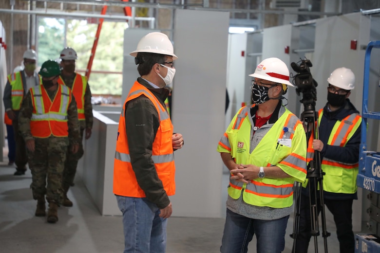 Ryan Field (right), Kalispell ACF project manager, USACE-Omaha, talks with Montana Governor Steve Bullock May 21, during a tour of the Kalispell, Mont., alternate care facility.