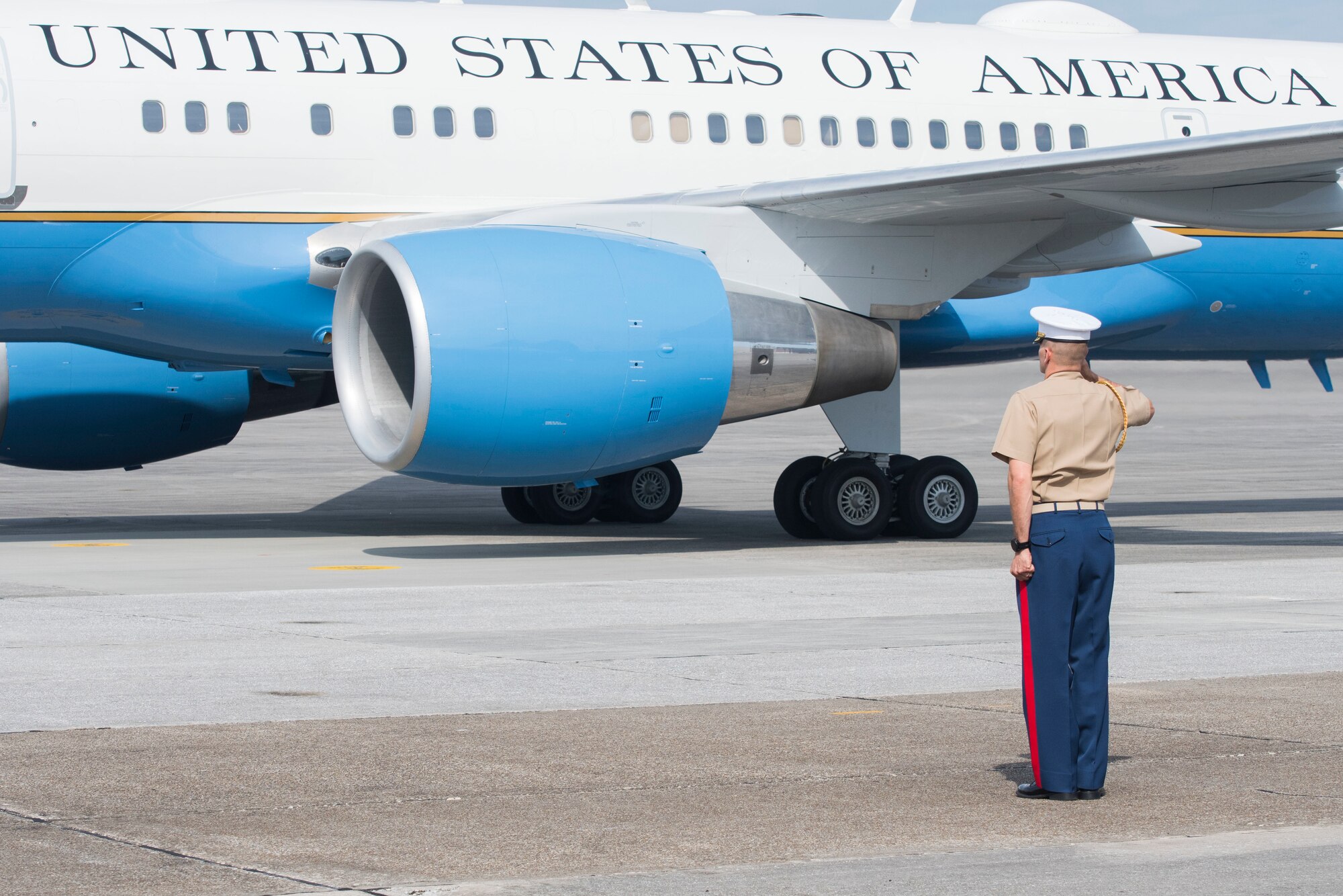 A Marine salutes Air Force Two as it taxis on the runway at Dobbins Air Reserve Base, Ga. May 29, 2020. Air Force Two landed here around 10 a.m., marking the second time in two weeks the vice president has visited Georgia. (U.S. Air Force photo/Andrew Park)