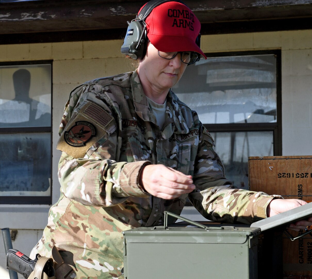 Staff Sgt. Tina Ryder, an Air National Guard Combat Arms instructor from the 149th Security Forces Squadron, prepares for weapons qualification training at a firing range at Joint Base San Antonio-Lackland’s Chapman Training Annex May 27. Members from the 149th SFS received training on the M-9 pistol, the shotgun and grenades during this training event.