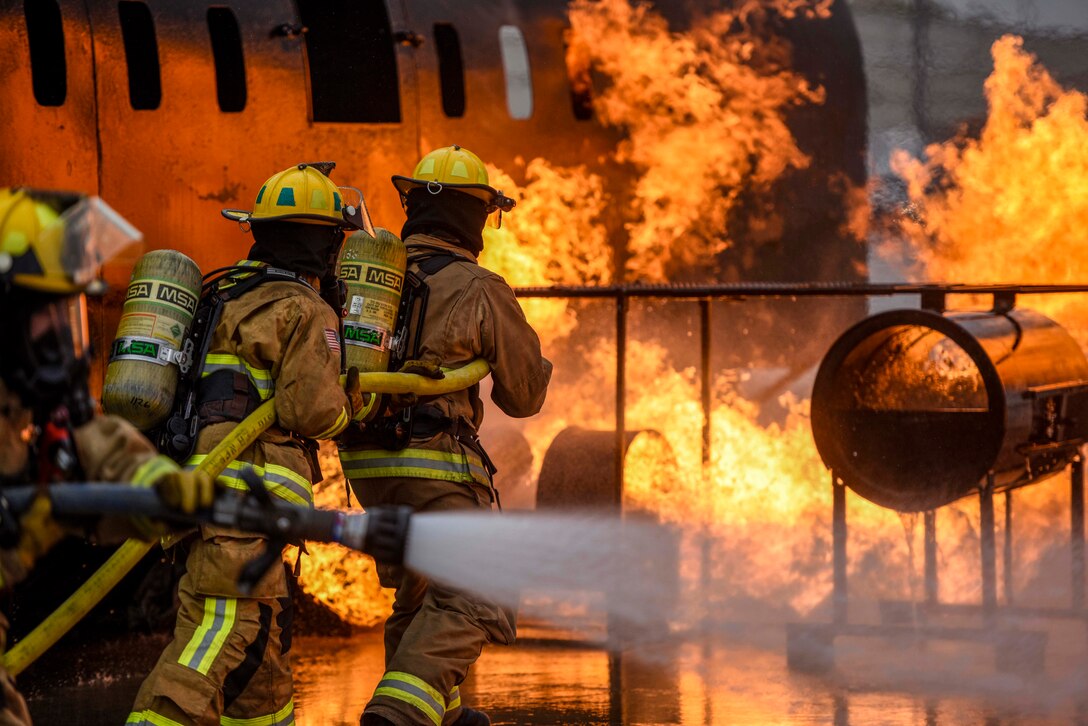 Firefighters extinguish controlled fires.