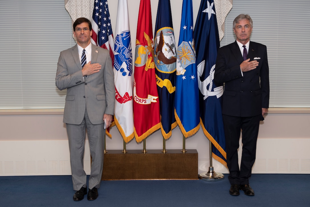 Defense Secretary Mark T. Esper prepares to swear-in retired Navy Rear Adm. Kenneth Braithwaite to serve as the next Secretary of the Navy in the Pentagon, May 29.