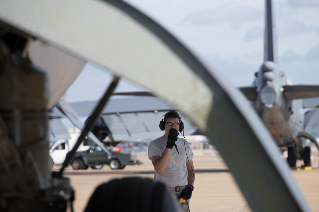 Airman waits outside a B-52