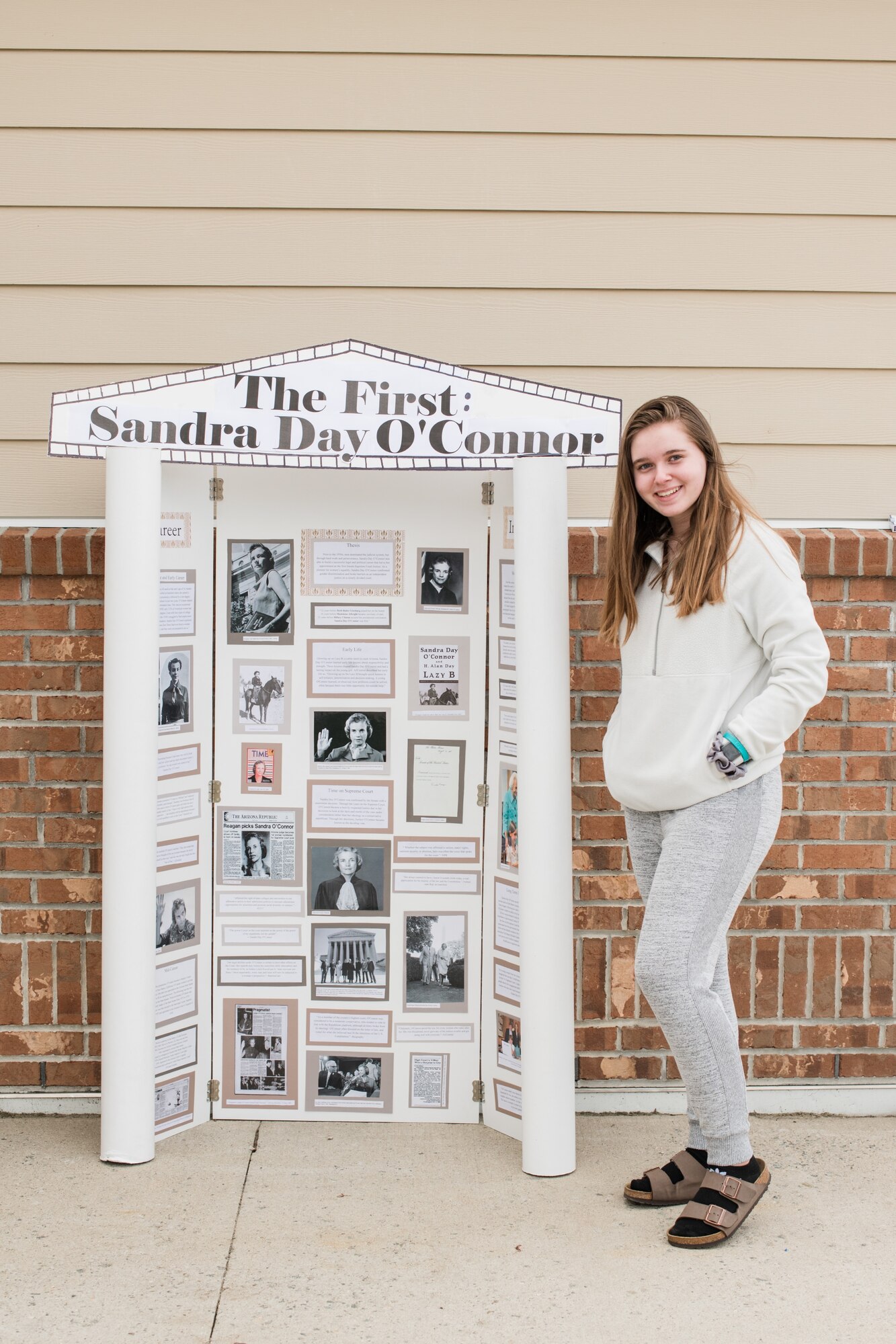 Emily Doucette, a Hanscom Middle School student, stands by her National history Day project at Hanscom Air Force Base, Mass. Doucette is one of seven HMS students to have advanced to the national-level, competing against students from across the U.S. and territories. (courtesy photo)