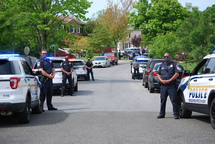 Pentagon Force Protection Agency police officers line the street of Clinton, Maryland, May 15, 2020, to welcome home one of their own, Patrick Bright, who nearly died from COVID-19. (Photo by Pentagon Force Protection Agency)