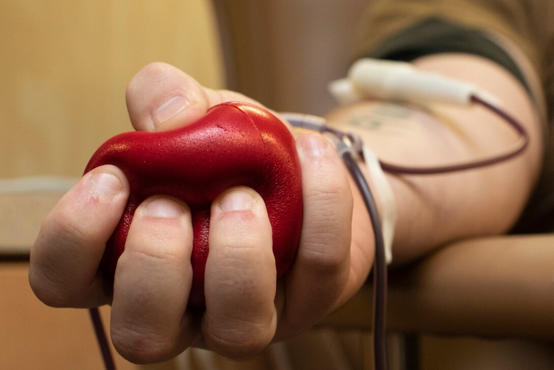 A closeup of a stress ball in a person’s hand.