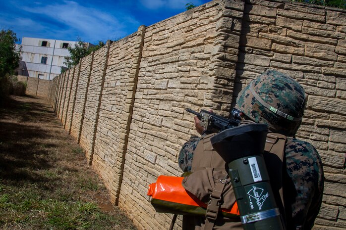U.S. Marine Corps Lance Cpl. Hector Pereyrabaez, a rifleman with Bravo Company, 1st Battalion, 3d Marine Regiment, posts security during military operations in urban terrain training, Marine Corps Base Hawaii, May 28, 2020. Bravo Company, 1st Battalion, 3d Marine Regiment, and Lima Company, 3rd Battalion, 3d Marine Regiment, conducted an amphibious assault exercise and military operations in urban terrain to increase littoral mobility proficiency in 3d Marine Regiment and advance the goals of the Commandant of the Marine Corps 2030 Force Design. (U.S. Marine Corps photo by Cpl. Matthew Kirk)