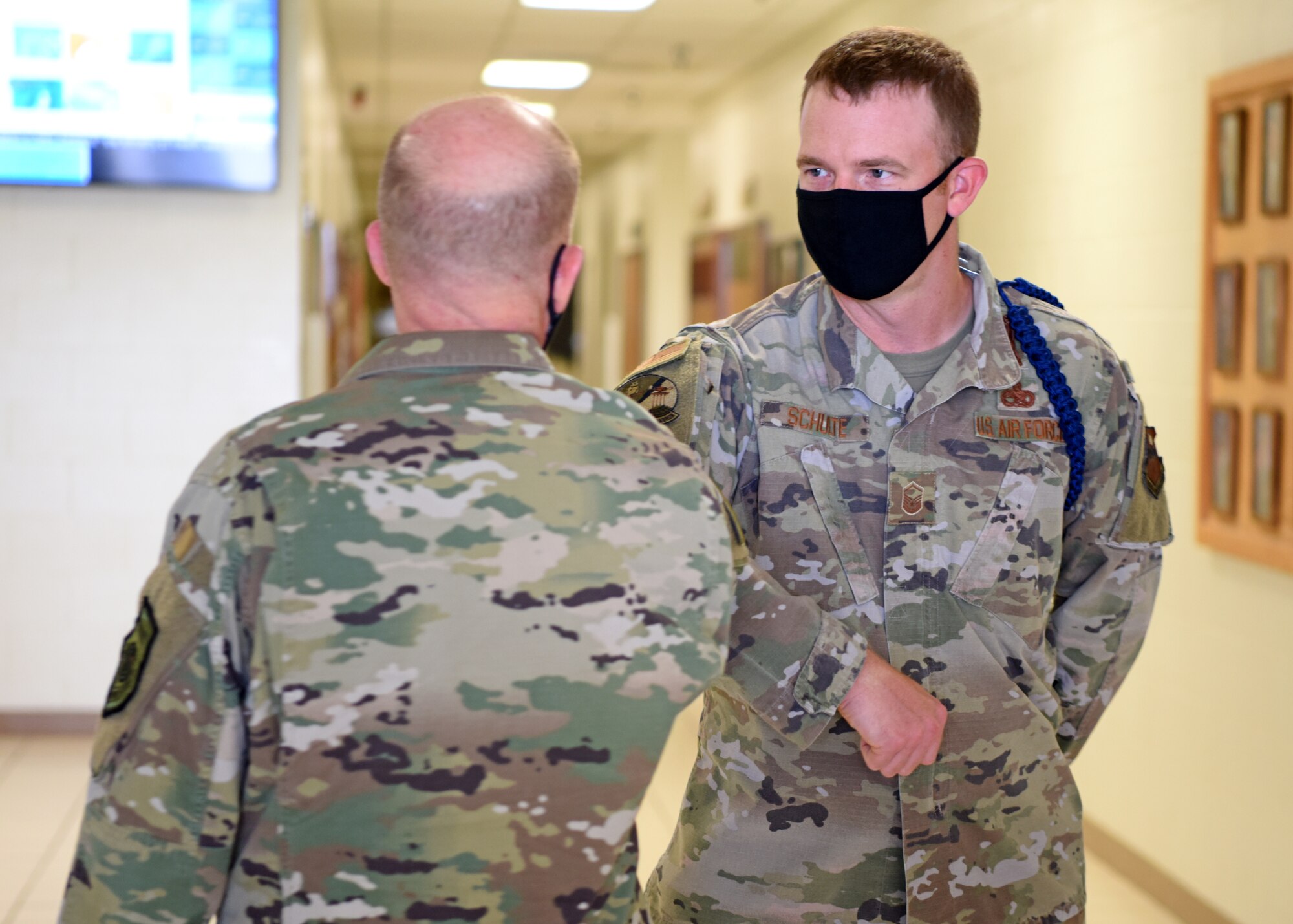 U.S. Air Force Gen. Stephen W. Wilson, vice chief of staff of the Air Force, greets Master Sgt. Nicholas Schulte, 312th Training Squadron flight chief, at the Louis F. Garland Department of Defense Fire Academy on Goodfellow Air Force Base, Texas, May 29, 2020. Instead of shaking hands, bumping elbows has become the new way to greet in light of COVID-19 health and safety measures. (U.S. Air Force photo by Airman 1st Class Ethan Sherwood)