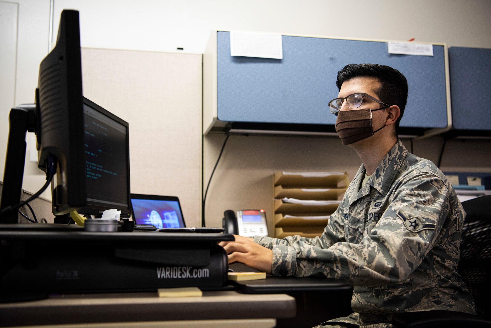 Airman Bernardino Campa, 30th Comptroller Squadron finance technician, virtually helps a finance customer May 21, 2020, at Vandenberg Air Force Base, Calif. During the COVID-19 pandemic, the 30th CPTS closed its doors to in-person appointments, taking a virtual approach to customer service. Making the appointments virtual helped to maintain their ability to assist customers while managing the possible spread of COVID-19. To stay positive during the pandemic, Campa turned to inspirational quotes serving as reminder to find the brighter parts of life. (U.S. Air Force photo by Senior Airman Hanah Abercrombie)