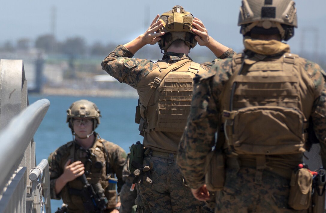 U.S. Marines with All-Domain Reconnaissance Detachment, 15th Marine Expeditionary Unit, prepare to embark on rigid-hull inflatable boats at Naval Amphibious Base Coronado, California, May 21, 2020. The ADR Detachment conducted visit, board, search and seizure drills as the culminating event of a two-week Maritime Interoperability Course, designed to enhance participants’ techniques for boarding and taking over vessels in preparation for an upcoming deployment. (U.S. Marine Corps photo by Sgt. Desiree King)