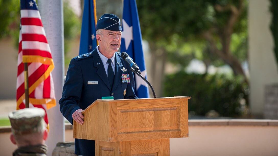 Maj. Gen. Christopher Azzano, Air Force Test Center Commander, addresses the family, friends and colleagues of Col. Christopher Spinelli, during Spinelli’s retirement ceremony at Edwards Air Force Base, California, May 29. Spinelli retired from the Air Force after more than 24 years of service and plans to head back home to Texas. (Air Force photo by Giancarlo Casem)