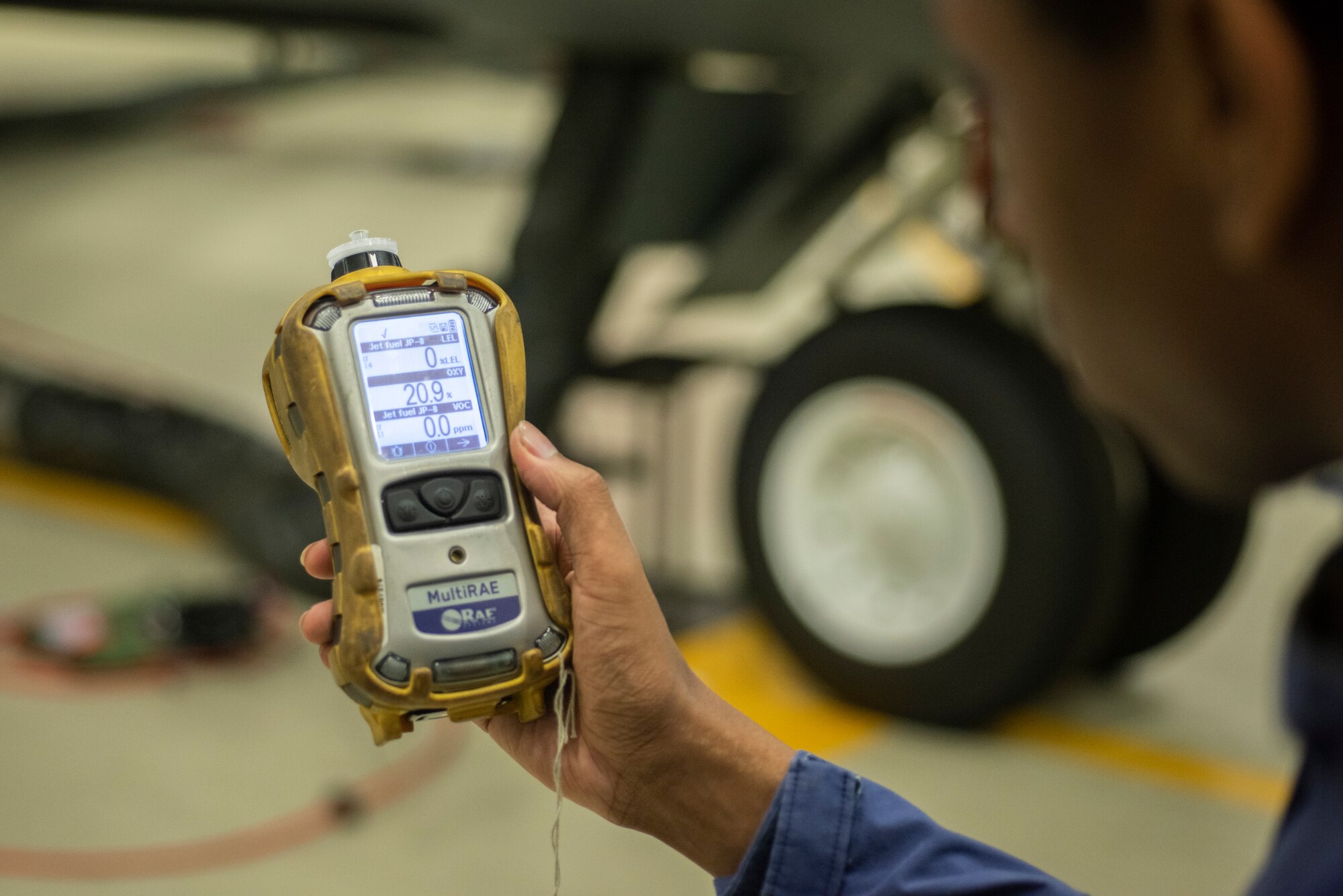 Airman 1st Class Dezmond Ross, 100th Maintenance Squadron fuel systems repair apprentice, tests the concentration of fuel vapor in the air using a photoionization detector at RAF Mildenhall, England, May 27, 2020. Fuel systems repair Airmen use the PID to determine if fuel vapor concentrations are low enough to safely perform maintenance. (U.S. Air Force photo by Airman 1st Class Joseph Barron)