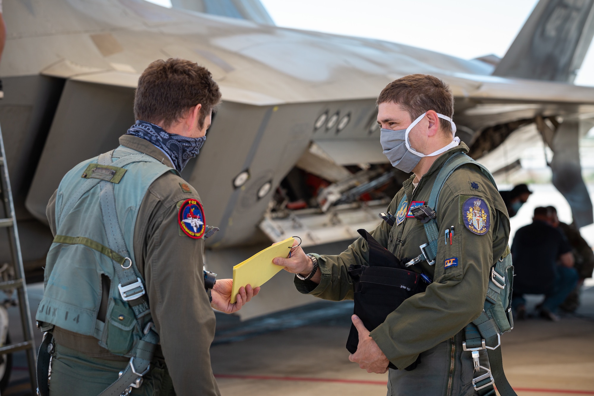 Maj. Benjamin Gilliland and Lt. Col. Tyler Robarge, both of the 411th Flight Test Squadron and F-22 Raptor Combined Test Force, conducted the base’s first operational rapid crew swap at Edwards Air Force Base, California, April 30. Robarge flew the first sortie and then swapped seats with Gilliland for the following sortie. (Photo courtesy of Kyle Larson/Lockheed-Martin)