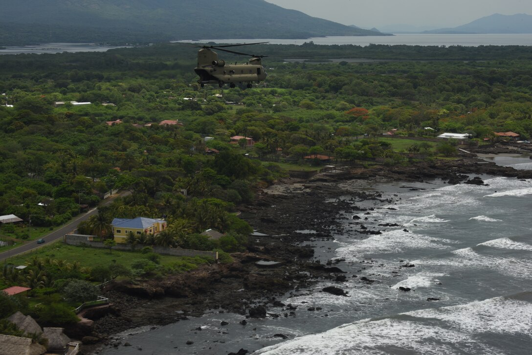 A U.S. Army CH-47 Chinook assigned to the 1st Battalion, 228th Aviation Regiment flies over the coast of Honduras and El Salvador during a Battalion Continuity of Operations (COOP) training flight formation May 28, 2020.
