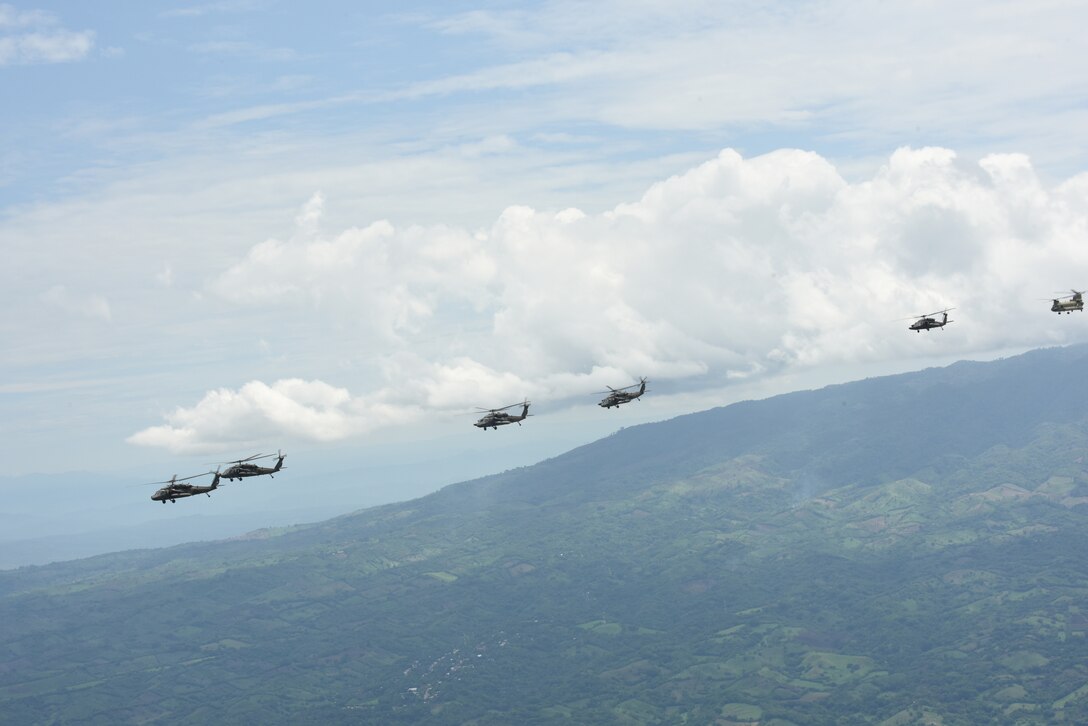 Four U.S. Army UH-60L Blackhawks and a CH-47 Chinook assigned to the 1st Battalion, 228th Aviation Regiment fly in formation during a Battalion Continuity of Operations (COOP) training exercise over Honduras and El Salvador, May 28, 2020.