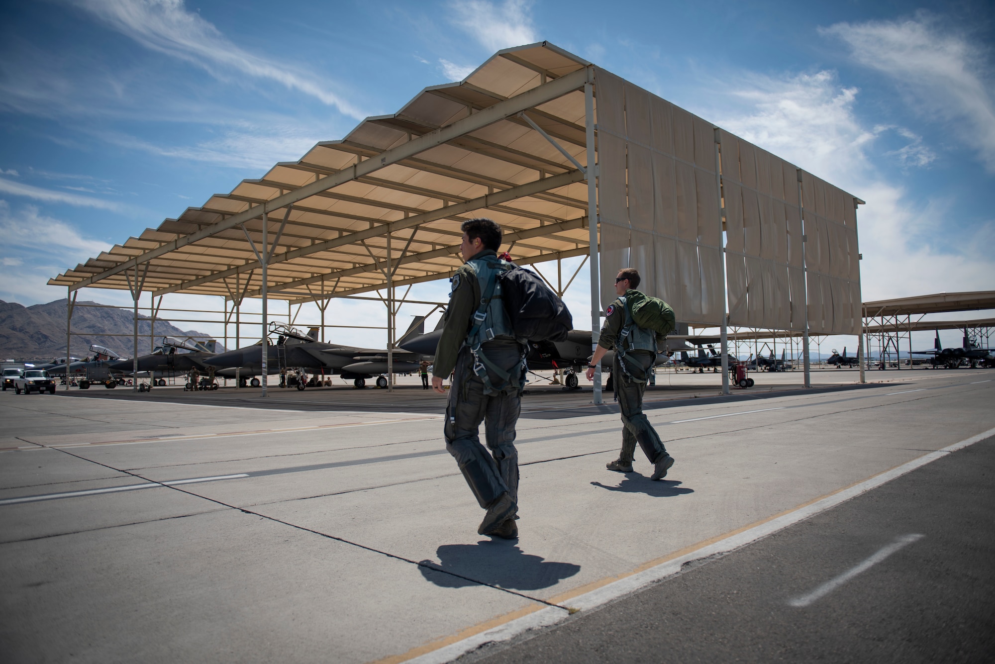 two pilots walking to their aircraft