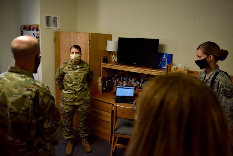 U.S. Air Force Airman Alyxandria Chaney, 316th Training Squadron student, explains to General Stephen Wilson, vice chief of staff of the Air Force, her daily routine of distance learning from her dorm room since the COVID-19 pandemic at the 316th TRS squadron housing on Goodfellow Air Force Base, Texas, May 29, 2020. Students now participate in a hybrid class allowing them to study and learn from either their dorm room or computer labs within the squadron housing. (U.S. Air Force photo by Senior Airman Seraiah Wolf)